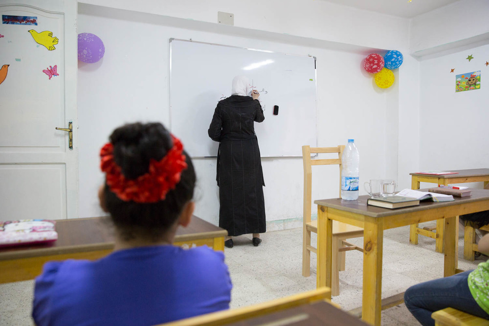 Fatma, has lived in Egypt for 2 years after fleeing her homeland of Syria. She now teaches after-school religious classes at Ansan's community center in Greater Cairo. Ansan (Human in English) is a partner organisation of Plan International Egypt.