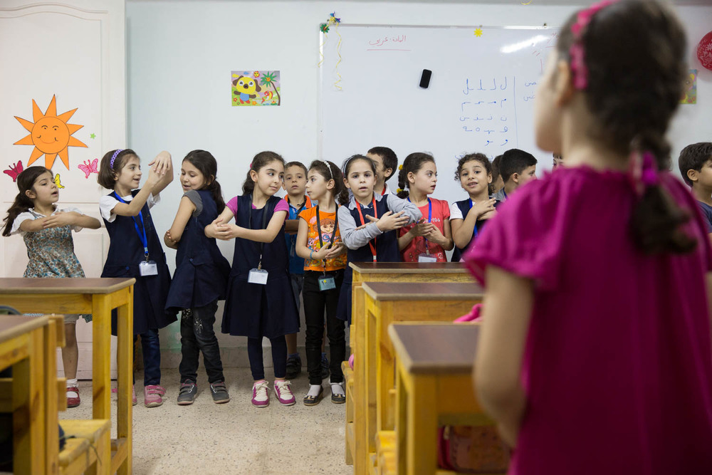Children perform a dance during remedial classes offered by NGO Ansan and Plan International.