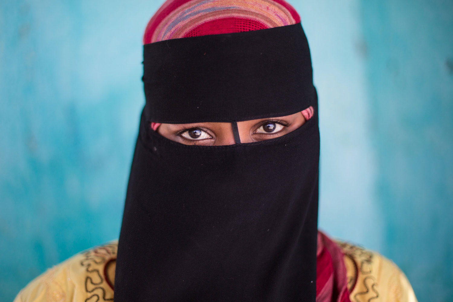  Fawzeya from Heisa Island wears the niqab when she goes out during the day, because she does not want her skin to tan.&nbsp;With Aswan located so close to the equator, it is sunny with summer-like temperatures all year around. 