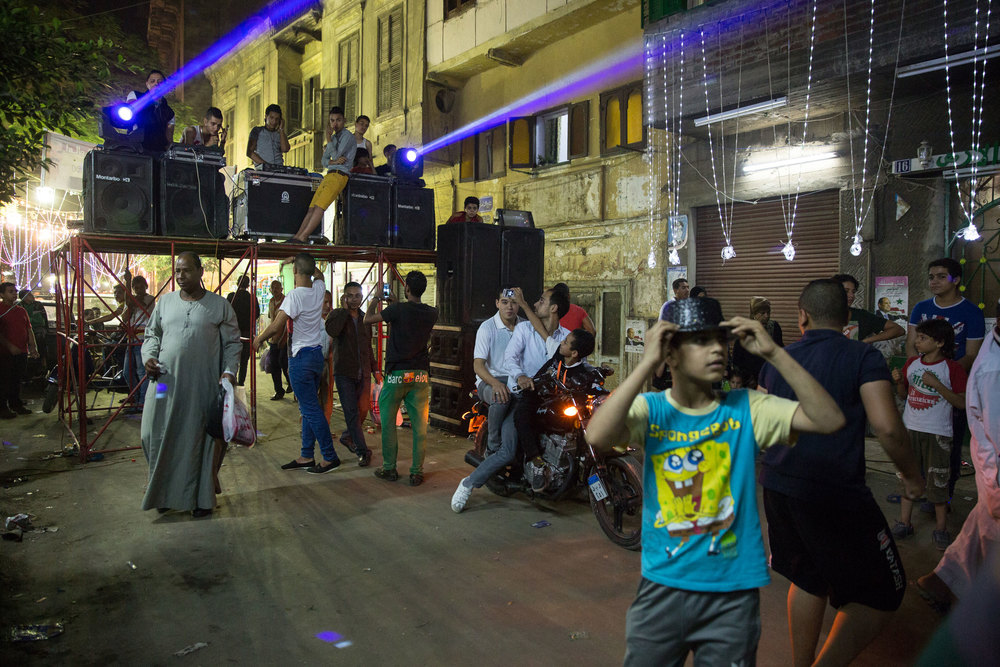 In a side street, local youth organized an electro-sha’abi dance party. While the main streets are filled with the festival, the locals often stay in side streets at their own gatherings.